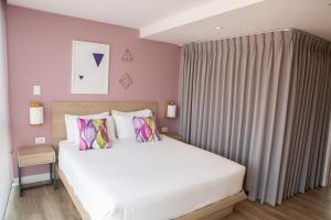 Ένα ή περισσότερα κρεβάτια σε δωμάτιο στο Urban Heights Bogota