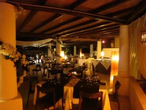a dining room with tables and chairs in a room at La Sirenetta Park Hotel in Stromboli