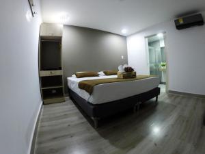 Postel nebo postele na pokoji v ubytování Hotel Boutique Plaza
