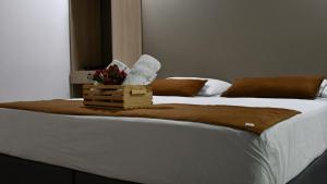 Postel nebo postele na pokoji v ubytování Hotel Boutique Plaza