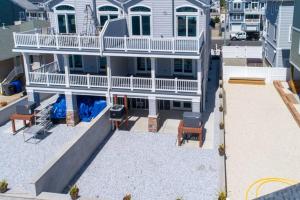 an aerial view of a house with a patio at Ocean and Beach Views from Five Decks in Ortley Beach in Seaside Heights