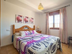 A bed or beds in a room at Apartment in Palomares near the Beach