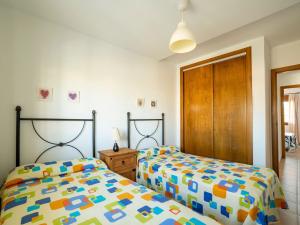 A bed or beds in a room at Apartment in Palomares near the Beach