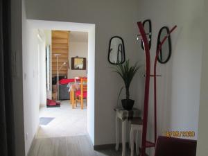 a hallway with a table and a dining room at Comfy holiday home in Crux La Ville with fenced garden in Crux-la-Ville