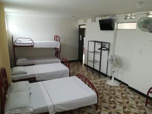 เตียงในห้องที่ Hotel Los Balcones