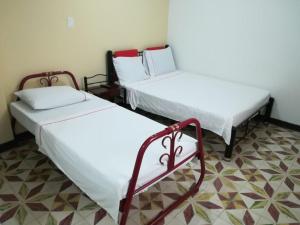 เตียงในห้องที่ Hotel Los Balcones
