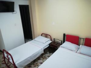 เตียงในห้องที่ Hotel Los Balcones