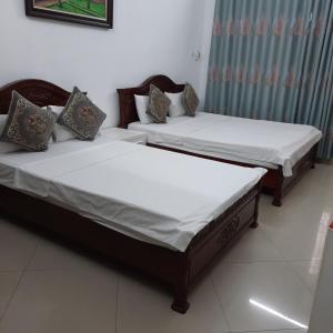 Voodi või voodid majutusasutuse Hanoi Carina Hotel toas