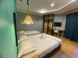 Postel nebo postele na pokoji v ubytování Smile Hotel Selayang Point