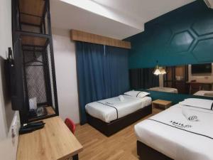 Postel nebo postele na pokoji v ubytování Smile Hotel Selayang Point