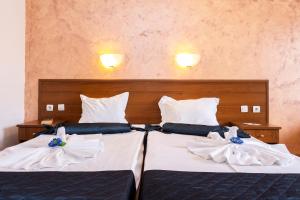 Postel nebo postele na pokoji v ubytování Complex Sunrise by HMG - All Inclusive
