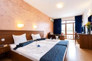 Postel nebo postele na pokoji v ubytování Complex Sunrise by HMG - All Inclusive