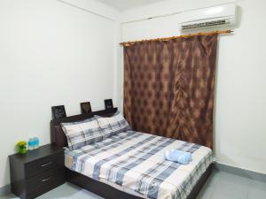 Кровать или кровати в номере Victoria Homestay Sibu - Next to Shopping Complex, Party Event & Large Car Park Area with Autogate