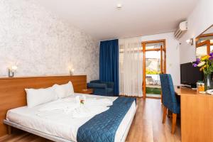 Postel nebo postele na pokoji v ubytování Complex Sunrise by HMG - All Inclusive