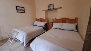 Hotel Noche Azul客房内的一张或多张床位