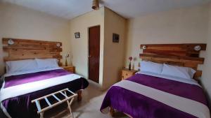 Hotel Noche Azul客房内的一张或多张床位