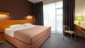 Postel nebo postele na pokoji v ubytování GOOD ZONE Hotel