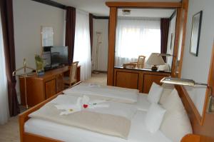 Postel nebo postele na pokoji v ubytování Hotel Friesengeist