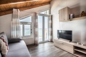 TV a/nebo společenská místnost v ubytování Amore Del Mare