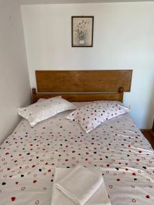 Кровать или кровати в номере Pensiunea Pusu