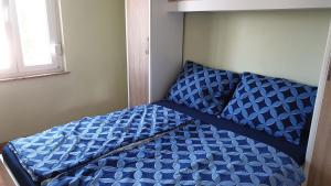 Postel nebo postele na pokoji v ubytování Apartments Roses