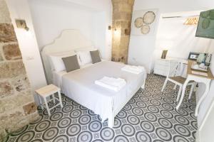 Ein Bett oder Betten in einem Zimmer der Unterkunft Di Lorenzi Albergo Diffuso