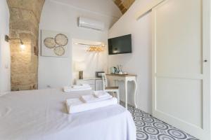 Ein Bett oder Betten in einem Zimmer der Unterkunft Di Lorenzi Albergo Diffuso