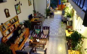 an overhead view of a room with tables and chairs at Moc Chau Cottage homestay in Mộc Châu