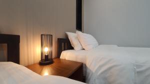 Postel nebo postele na pokoji v ubytování Sabua The Terrace Homestay