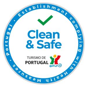 a blue clean and safe logo at Hotel Jardim in Aveiro