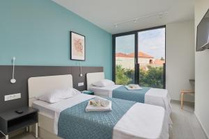 Posteľ alebo postele v izbe v ubytovaní Tiffany Apartments