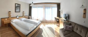 Gulta vai gultas numurā naktsmītnē Hotel Garni Aurora