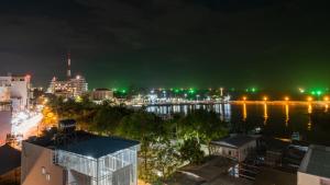 a view of a city at night at Nipola Hotel - Chợ Đêm Dương Đông Phú Quốc in Phú Quốc