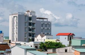 a tall building in the middle of a city at Nipola Hotel - Chợ Đêm Dương Đông Phú Quốc in Phú Quốc