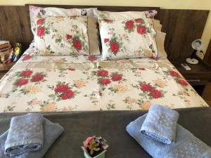 Cama ou camas em um quarto em Sítio Flora Rei