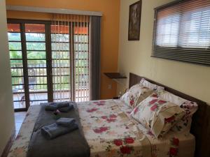 Cama ou camas em um quarto em Sítio Flora Rei