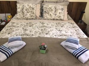 Cama ou camas em um quarto em Sítio Flora Rei