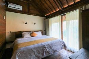 Waterside inn Nusa Penida客房内的一张或多张床位
