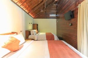 Waterside inn Nusa Penida客房内的一张或多张床位