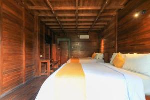 Waterside inn Nusa Penida客房内的一张或多张床位