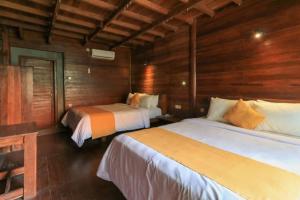 Waterside inn Nusa Penida客房内的一张或多张床位