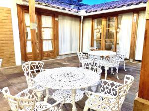 a group of tables and chairs on a patio at HOTEL BOUTIQUE EL CAMPANARIO in San Gil