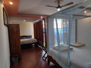Letto o letti in una camera di Sea Front Beach Huts