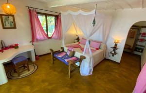 Postel nebo postele na pokoji v ubytování Butiama Beach Lodge