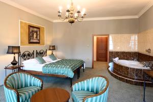 Postel nebo postele na pokoji v ubytování Hotel Bouček