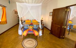 Postel nebo postele na pokoji v ubytování Butiama Beach Lodge