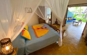 Postel nebo postele na pokoji v ubytování Butiama Beach Lodge