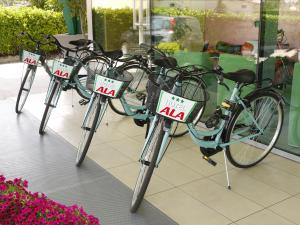 
a row of bikes parked next to each other at ALA Hotel in Treviso
