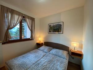 Un pat sau paturi într-o cameră la Penzion Gabriel
