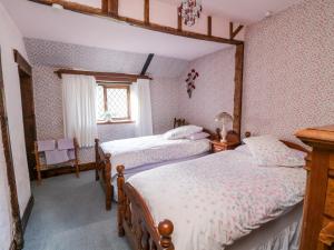 a bedroom with two beds and a window at Hayloft at Magnolia Lake in Exeter